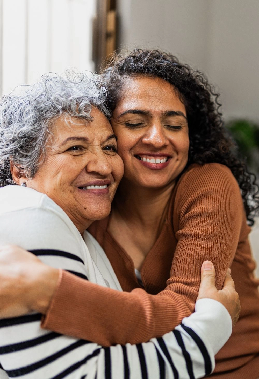 caregiver hugging senior 9