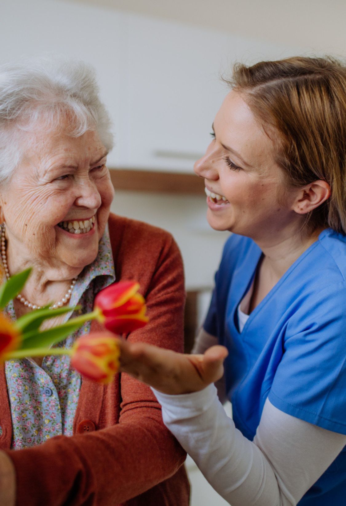 caregiver and senior sharing a joyful moment during home care in Beavercreek, OH